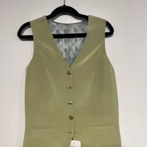 sage green vest
